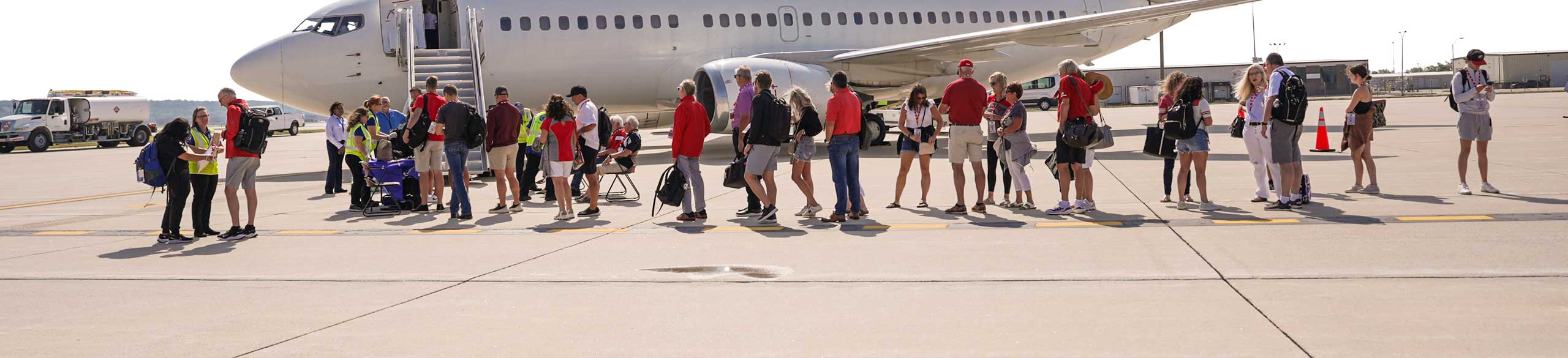 people waiting to board a plane