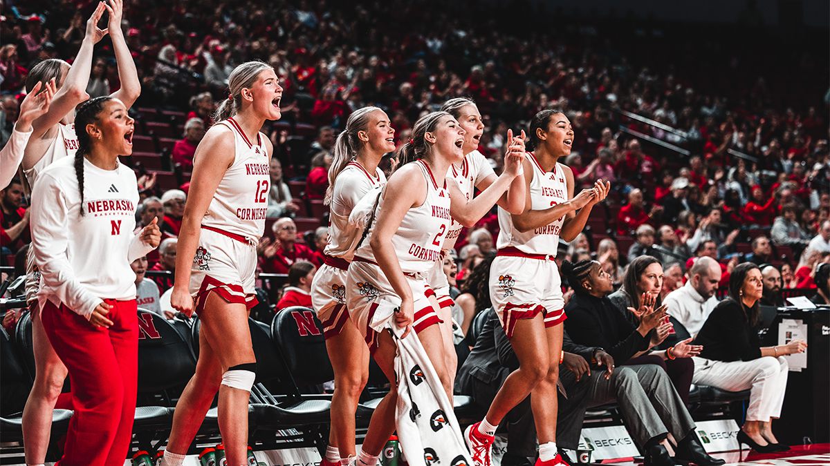 Women's Basketball players celebrating