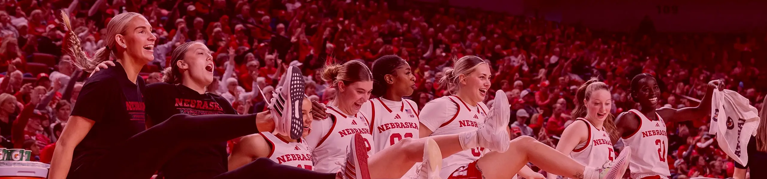 basketball players looking up on sideline
