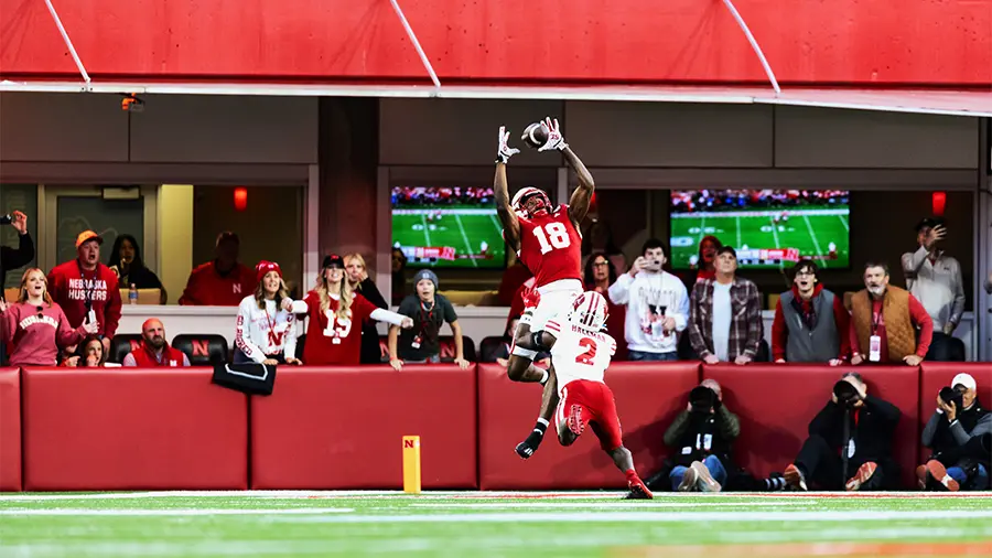 Football player jumping up to make a catch
