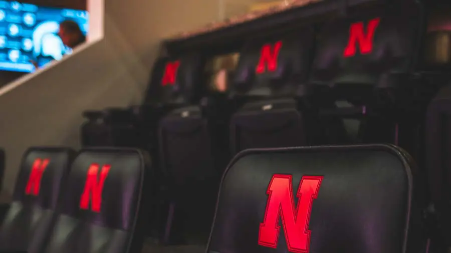 Empty chairs with fridge in the back